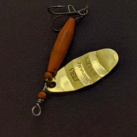 Abu Garcia Spinnaren Reflex Rotačka, Mosaz/Červená, 7g, #24456